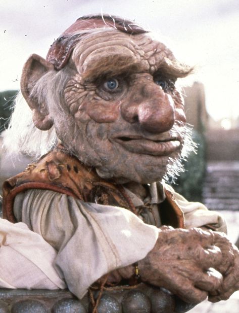 Hoggle is a supporting character in Labyrinth, and becomes a loyal friend of Sarah's after he defies his master Jareth to accompany her on her quest. Hoggle was voiced by Brian Henson, and performed by Shari Weiser. Through Dangers Untold, Labyrinth Tattoo, Jim Henson Labyrinth, David Bowie Labyrinth, Bowie Labyrinth, Labyrinth 1986, Magic Dance, The Goblin King, Labyrinth Movie