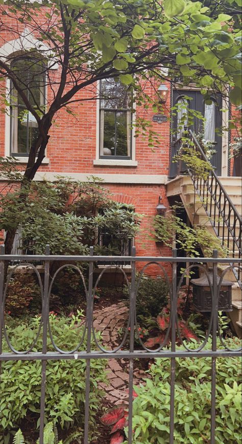 Historical red brick house with stairs leading to the entrance. Below is a small garden with a red brick path that is surrounded by wrought iron fencing Antique Mailbox, Chicago Brick, Brick Path, Wrought Iron Fences, Iron Fence, Downtown Chicago, City Garden, Garden Fence, Red Bricks