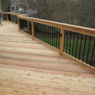 This deck features unique design features for a traditional, yet contemporary look. Natural cedar wood was used for the elevated deck and rails; however, black Deckorators balusters were added to the railing for a contemporary twist.  Notice the black accent lights and floor board pattern too. The entire project was custom designed to enhance the backyard view and blend indoor living spaces with the outdoors. Covered Deck Ideas On A Budget, Yard Upgrades, Elevated Deck, Screen Porches, Backyard View, Deck Addition, Deck Railing Design, Deck Pool, Wood Porch