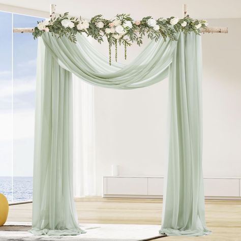 PRICES MAY VARY. ❤️Wedding Arch Drapes Material: These drapery fabric panels are made of an unique fabric that has a slight shimmer, they are silky soft and more graceful than tulle or nylon fabrics. ❤️Wedding Arch Draping Fabric Package: Package including 2 panels sage green wedding arch drapes, each panel is 30" wide and 20ft long. ❤️Wedding Arch Reference: The arch in the images are 6.5 ft wide by 6.5 ft tall. The drapes fabric can be used in many different depends on the look you want. It wi Sage Green Wedding Arch Ideas, Sage Green Arch Wedding, Wedding Outdoor Arch, Pastel Green Wedding Decor, Green Floral Wedding Decor, Sage Green Backyard Wedding, Arbors For Weddings, Front Porch Wedding Decorations, Dusty Blue And Sage Green Wedding Decor