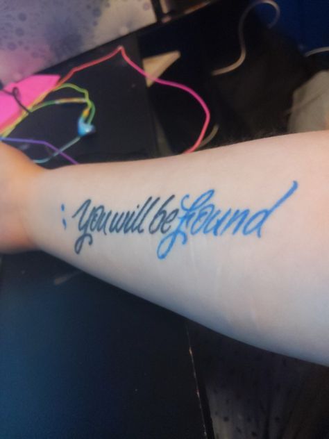 A tattoo on a pale forearm with fading scars. The tattoo is script saying "; you will be found" the semicolon and the word "found" is blue Semicolon Tattoo, Evan Hansen, My Tattoo, Dear Evan Hansen, Still In Love, Tattoo Idea, I Tattoo, A Year, Tattoo Quotes