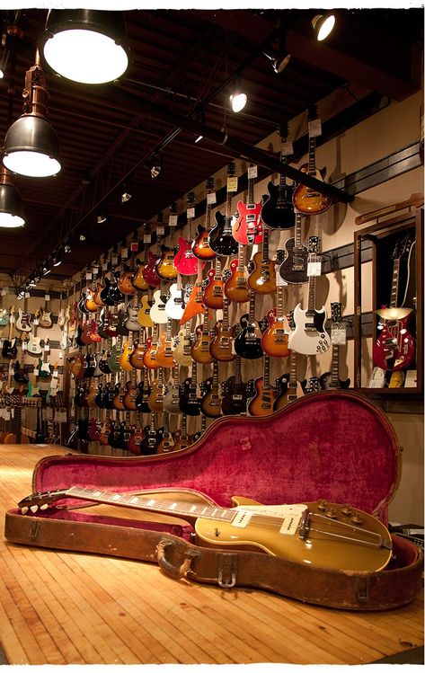 Wonderful guitar shop aesthetic! Buying a new or used guitar should be an enjoyable experience. Next time you're in the market for a guitar, fine, go ahead and do your homework online, but the shift from brick and mortar to online guitar sales has put many a small town corner music store under in just that last five years alone. If you wish your only options in the future to be either buying online or going to your watered-down area Guitar Center, then go right ahead. But do so knowing the cost. Instrument Shop Aesthetic, Guitar Store Aesthetic, Guitar Shop Aesthetic, Music Shop Aesthetic, Music Store Aesthetic, Music Store Interior, Music Store Design, Guitar Studio, Do Your Homework