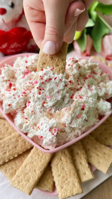 Dee on Instagram: "Have a sweet tooth? Make this Little Debbie Valentine’s Day Cake Dip! This treat is light, fluffy and super easy to make. All you have to do is: 1) Add one 8oz block of softened cream cheese bowl to a mixing bowl and beat with an electric mixer. 2) Add in 1tsp of vanilla extract. Mix well. 3) Crumble in 10 heart cakes and lightly beat with an electric mixer. 4) Gently fold in one 8oz tub of cool whip with a spatula. 5) Stir in Valentine’s Day sprinkles. 6) Transfer into Vday Dessert, Cheese Bowl, Cake Dip, Little Debbie, Heart Cakes, Vanilla Wafers, Electric Mixer, Snack Cake, Cool Whip