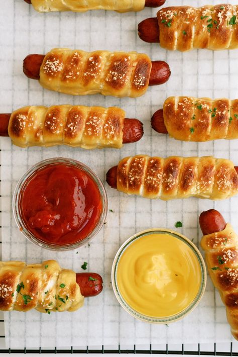 pretzel dogs on a cooling wrack with ketchup and mustard Pretzel Dog Recipe, What To Serve With Chili, Pretzel Dogs Recipe, Serve With Chili, Chili Side Dishes, Pretzel Dog, Pretzel Dogs, Frozen Rolls, Chili Toppings