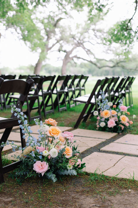 Ceremony wedding flowers. Summer Floral Arch Wedding, Wedding Aisle Markers Flowers, Wildflower Chair Decor, Whimsical Aisle Flowers, Flower Rustic Wedding, Wedding Aisle Flower Decorations, Diy Flower Columns, Summer Wedding Aisle Flowers, Rainbow Flowers Wedding