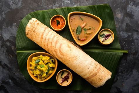 Dosa on a banana leaf is a famous Indian food South Indian Snacks Recipes, Indian Snacks Recipes, Food Plating Ideas, South Indian Snacks, Indian Food Photography, Desi Street Food, Food Plating Techniques, Indian Masala, Masala Dosa