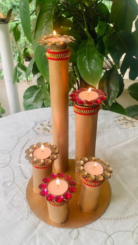 Difficulty: Easy     DIY CANDLE STAND PREPARED BY TOILET PAPER & KITCHEN PAPER CARDBOARD STAND & I have also used cake base cardboard which we get with every cake AS A BASE FOR CANDLE STAND ……..  • :  • 💥U just need golden colour choice is totally yours either u can use spray paint or acrylics…  • 💥I have used lace to give it a festive look….  • :  • :  :  Use it all whatever way u like and your FESTIVE CANDLE STAND IS READY …….  • :  • :  • So why are you waiting , let’s start getting ready for festivities …..  • :  • :  • 📌IF U LIKE THE IDEA SHARE AND SAVE IT FOR REFERENCE   • AND STAY TUNED FOR MORE FESTIVE DIY WITH ME @magic_of_green Candle Stand Diy, Cardboard Stand, Diwali Activities, Paper Kitchen, Janmashtami Decoration, Diwali Decorations At Home, Cake Base, Diwali Decoration Items, Diy Diwali Decorations