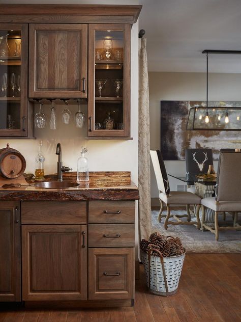 Beyond offering a place to mix drinks, a wet bar can play an important design role in a home with an open layout, linking the kitchen workspace with the entertaining areas of the house. Here, designer Amy Darooge used rustic materials to create a coherent style throughout. She chose distressed wood cabinetry, a copper sink and faucet, and “the material on the counter is walnut with a live ledge,” she says. Wet Bar Ideas With Sink, Receiving Room, Bar With Sink, Small Home Bar Ideas, Kitchens Rustic, Wet Bar Ideas, Lodge Bar, Kitchen Workspace, Small Bars For Home