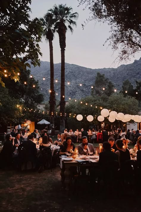 glowy string lights and paper lanterns for a dinner-party-inspired wedding reception in Palm Springs, CA Retro Palm Springs Wedding, Parker Palm Springs Wedding, Palm Springs Elopement, Retro Palm Springs Aesthetic, Palm Springs Wedding Decor, Wedding String Lights, Palm Springs Wedding Venues, Carnation Wedding, Palm Springs Desert