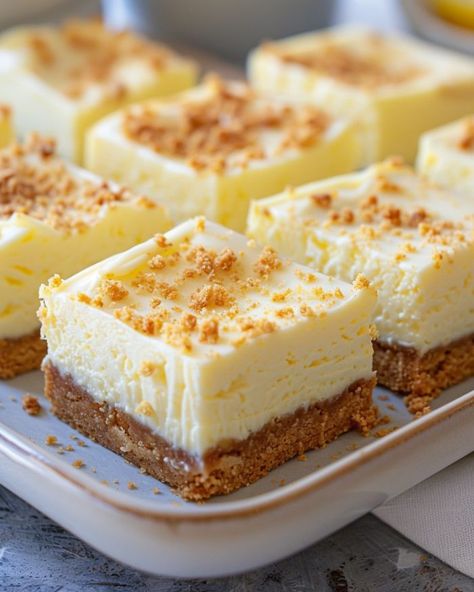 Such an awesome recipe! My niece swoops in for these treats as soon as they hit the table. They never fail to impress! Lemon Cheesecake Bars, Cheesecake Squares, Biscuits Graham, Lemon Cheese, Dessert Simple, Lemon Dessert Recipes, Dessert Bar Recipe, Refreshing Desserts, Dessert Options