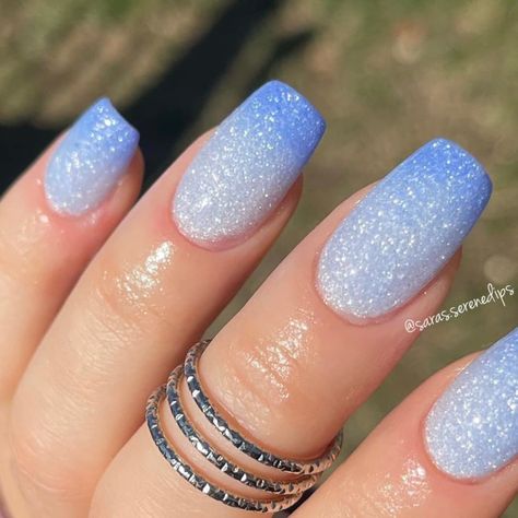 Top 25  Blue Dip Nail Designs to Try in 2024 Ombre Glitter Dip Powder Nails, Blue Glitter Gradient Nails, Blue And White Nails With Glitter, Simple Sns Nail Designs, Nails For Winter Formal Dance, Blue Nails Easy Design, White And Blue Dip Nails, Cold Blue Nails, White Nails With Blue Sparkles