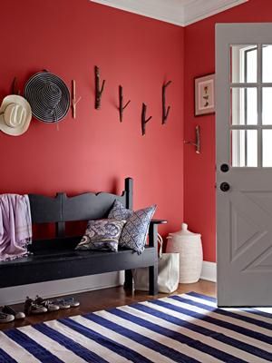 Why hide your personality? Greet guests with a foyer painted an inviting rustic red. Foyer Paint, Striped Rugs, Color Of The Week, Coral Walls, Red Decor, Red Rooms, Blue Home Decor, Design Del Prodotto, Red Walls