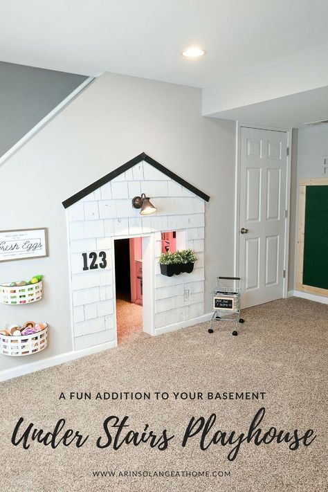 A fun addition to our basement has been this playhouse under the stairs. It is 3 full rooms, and complete with electricity. The update with cedar shake shingles is up on the blog, so be sure to check it out! https://www.arinsolangeathome.com #playhouse #diy #understairsplayhouse Under Stairs Playhouse, Under Stairs Playroom, Under Stairs Dog House, Room Under Stairs, Diy Playhouse, Basement Playroom, Studio Kitchen, Dog Rooms, Understairs Storage