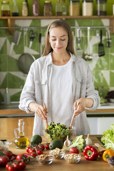 Only healthy food. Attractive young woman mixing salad by Prostock-studio. Only healthy food. Attractive young woman mixing salad in a bowl and smiling while standing in the kitchen #AD #young, #woman, #mixing, #healthy Salad In A Bowl, Healthy Eating Snacks, High Calorie Meals, Product Shoot, Female Art Painting, Kitchen Corner, Healthy Kitchen, Stylish Kitchen, How To Make Salad