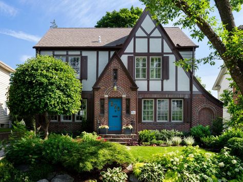 Brown and cream windows. Blue door. Shutters. Brick House With Shutters, Tudor Landscaping, Tudor Home Exterior, Indoor Door Colors, House With Shutters, Tutor Style Homes, Home Exterior Colors Schemes, Tudor Exterior, Tudor House Exterior