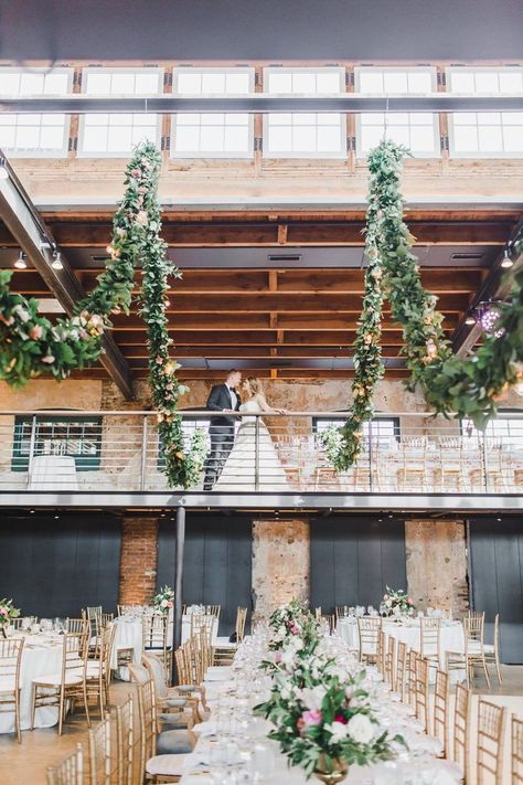 Hold up! Was this  industrial Baltimore wedding venue touched by a green thumb? Draped garlands, soaring floral pillars and botanical escort cards are just a few of the details we are loving, and you will just have to see the rest for yourself! Did we mention this wedding comes with an adorable doggo too? #ruffledblog Wedding Venues Maryland, Light Blue Wedding Theme, Floral Pillars, Dog Of Honor, Wedding Dress Preservation, Wedding Ceremony Script, Industrial Chic Wedding, Industrial Wedding Venues, Maryland Wedding Venues