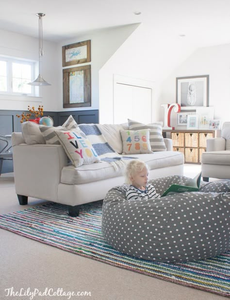 Colorful Playroom Decor featuring white walls and lots of colorful accents. Family Room Playroom, Loft Playroom, Lilypad Cottage, Playroom Inspiration, Loft Area, Colorful Playroom, Basement Playroom, Playroom Design, Playroom Ideas