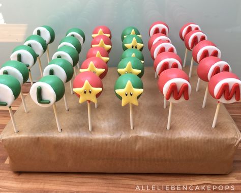 Super Mario cake pops Super Mario Bros Cakesicles, Super Mario Chocolate Covered Strawberries, Super Mario Cakepops, Mario Cake Pops Easy, Super Mario Cakesicles, Super Mario Bros Cake Pops, Mario Bros Cake Pops, Princess Peach Cake Pops, Mario Cakepops