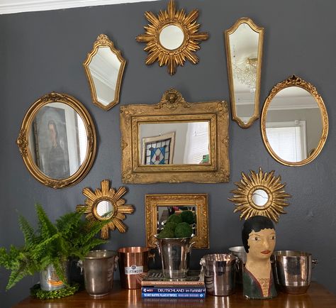 Mirror gallery wall and champagne bucket display featuring finds from European flohmarkts.   In-home design provided by Domestic Provisions.   Sunburst mirror procured by Emilia’s Beautiful Things. #mirrorgallery #mirrorgallerywall #frenchmillineryhead #champagnebuckets #sherwinwilliamspeppercorn Different Mirrors On Wall, Sunburst Decor, Cool Wall Mirrors, Mirror Display Wall, Mirror Wall Vintage, Wall Of Mirrors Bedroom, Vintage Mirrors Wall, Gallery Mirror Wall, Mirror Wall Gallery