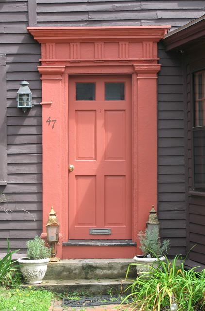 An Urban Cottage: Inspiration Photos Teal And Coral House Exterior, Salmon Door Color, Salmon Pink Front Door, Coral Door Gray House, Coral Door Front Entrance, Coral Front Door Colors, Salmon Front Door, Peach Front Door, Front Door Entrance Decor