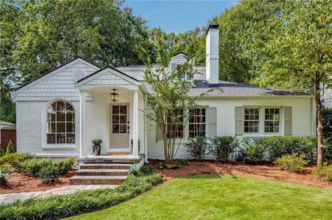 727 Burke Rd NE, Atlanta, GA 30305 | realtor.com® Adding Gables To A Ranch Home, White Brick Ranch House Exterior, Brick Ranch House Exterior, White Ranch House Exterior, Patio Exterior Ideas, Small Ranch House Exterior, Ranch Exterior Makeover, White Ranch House, Low Country Cottage