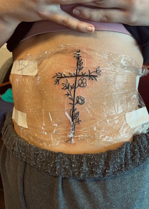 Flower Cross Rib Tattoo, Cross W Flowers Tattoo, Joshua 1 9 Tattoo With Cross, Side Tattoos For Women Rib, Cute Tattoos For Women Ribs, Rib Cross Tattoos For Women, Tattoo Ideas Western Simple, Flower Cross Tattoos For Women, Cross On Ribs Tattoo