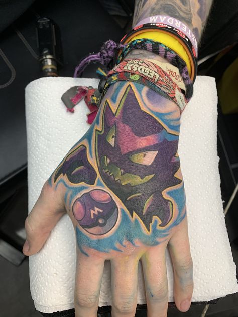 Haunted Pokemon hand tattoo #pokemontattoo Video Game Hand Tattoo, Pokemon Finger Tattoo, Pokemon Hand Tattoo, Master Ball Tattoo Pokemon, Pokemon Tattoo Pokeball, Pokemon Forearm Tattoo, Pokemon Ball, Knuckle Tattoos, Pokemon Tattoo