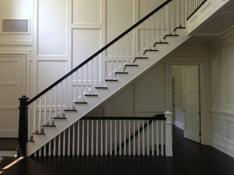 open staircase to basement and floor to ceiling wainscoting Stacked Staircase Open, Stacked Stairs Open, Basement Stairs At Entryway, Open Stair Railing To Basement, Open Concept Basement Stairs, Three Story Staircase, Stairs To Basement Ideas, Stacked Stairs, Stacked Staircase