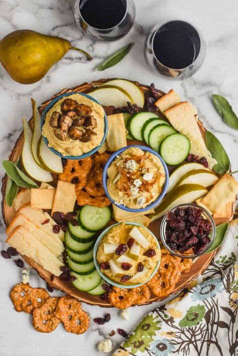 This Hummus Charcuterie Board is easy to throw together with three great spins on hummus. It's something your party guests will keep coming back to! Hummus Charcuterie Board, Friendsgiving Charcuterie Board, Friendsgiving Snacks, Hummus Bowl, Chicken Protein, Charcuterie Inspiration, Cucumber Recipes, Chicken Kebabs, Thanksgiving Appetizers