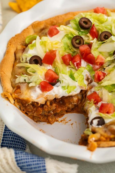 Mix up your next taco night with this delicious, easy taco pie recipe. It's loaded with ground beef, onion, bell pepper, salsa, refried beans, corn, and taco seasoning, all topped with shredded cheese and baked in a savory pie crust. This taco pie is going to be a new family favorite dinner! Taco Pie With Bisquick, Bell Pepper Salsa, Easy Taco Pie, Mexican Pie, Savory Pie Crust, Enchilada Pie, Taco Pie Recipes, Chili Pie, Gluten Free Bisquick