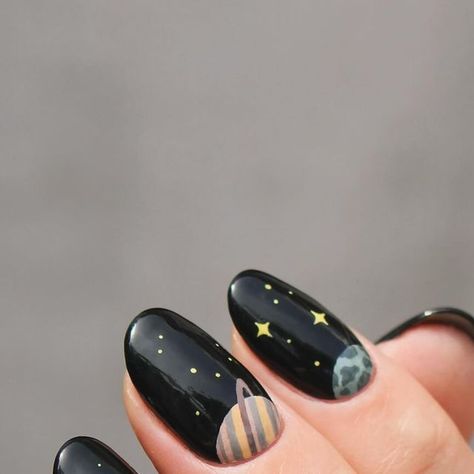 Eva on Instagram: "When in doubt, I bring the planets out. It’s no secret that planet/space manis are my favorite and I’ve done many planet manis over the years. I’ve never done a half moon planet mani, (only actual half moons🌛) so I thought that would be fun!  AND I did both hands! When I do, I only do my other thumb but never a full mani, but this just called for it so I could get all the planets in. (I did want to show a pic of this, but the pictures of it turned out so bad, and my right hand really isn’t all that pretty.)  Really love how it turned out🪐🌍" Planet Inspired Nails, Space Inspired Nails, Solar System Nails, Black Moon Nails, Space Themed Nails, Cute Shellac Nails, Planet Nail Art, Neutral Nail Art Designs, All The Planets