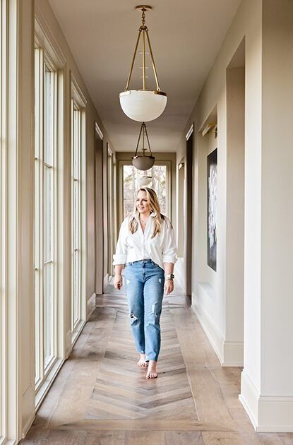 Lori Paranjape walks down a beige hallway with wood flooring and floor-to-ceiling windows. Best House Paint Colors, Bleeker Beige, Beige Hallway, Cozy Bedroom Colors, Light Paint Colors, Neutral Curtains, Benjamin Moore Paint Colors, Paint Colors Benjamin Moore, Benjamin Moore Colors