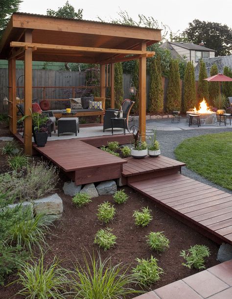 Outdoor structures and wood pathways make this landscape design a unique artsy haven. Pop im to tour the other elements . . . Landscape Wooded Area, Japanese Backyard Ideas, Rustic Outdoor Structures, Modern Outdoor Structures, Porch Stain, Japanese Pergola, Wood Pathway, Japanese Backyard, Pergola Shade Diy