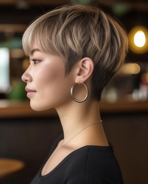 The ash blonde pixie is a sophisticated, chic style that exudes elegance. With its soft, layered texture, cool ash blonde tones, long pixie Low Fade Pixie Cut, Ash Brown Pixie, Dark Blonde Pixie Haircut, Brown Pixie Hair, Ash Blonde Pixie, Pixie Highlights, Stacked Pixie, Dark Ash Blonde Hair, Cool Ash Blonde