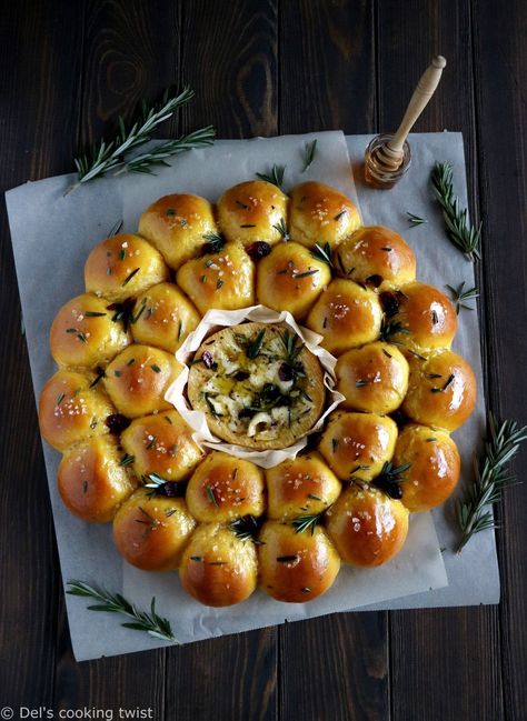 This rosemary sweet potato bread wreath with a baked camembert center makes a stunning holiday appetizer and centerpiece. The dinner rolls are soft, pillowy, and highly addictive. Dip in the warm, melted camembert, and enjoy this festive pull-apart bread while still warm.