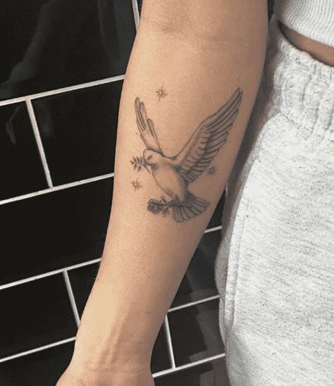 Dove With Initial Tattoo, Dove Rib Tattoo, Dove Tattoo On Neck, Dove Tattoo With Flowers, Dove Tattoo Aesthetic, Dove Tattoo Arm, Dove Holding Olive Branch Tattoo, Dove With Flowers Tattoo, Dove Arm Tattoo