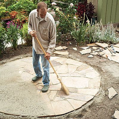 creating a flagstone patio space - Sunset Magazine for details... Flagstone Patio Design, Fire Pit Wall, Circular Patio, Modern Fire Pit, Fire Pit Landscaping, Metal Fire Pit, Stone Patio, Stone Fire Pit, Flagstone Patio