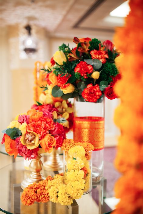 Diwali festive colorful floral set up for hotel lobby. Diwali Flowers, Mehendi Decor Ideas, Colorful Centerpieces, Cubicle Decor Office, Tall Centerpieces, Cubicle Decor, Big Fat Indian Wedding, Talent Acquisition, Floral Set