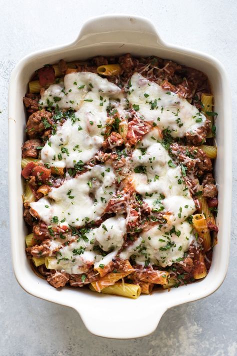 Baked pasta with pockets of melted cheese inside with an easy-to-make tomato sauce with sausage (no chopping!). This hearty pasta recipe is easy to prep, can be made ahead, and makes for a cozy and comforting fall dinner. #pasta #rigatoni #tomatoes #sausage #Italiansausage #cooking #recipes #dinner #comfortfood Pasta Recipes Sausage, Easy Baked Pasta, Hearty Pasta Recipes, Pasta Rigatoni, Sausage Dinner, Baked Rigatoni, Sausage Pasta Recipes, Dinner Pasta, Ziti Recipes