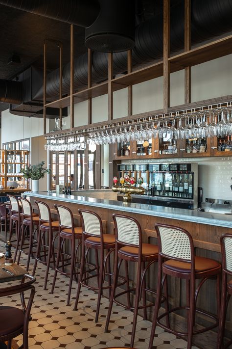 Bistro Le Bleu in Aarhus, Denmark has an airy and light interior design with large windows and a high ceiling. To ensure the bistro’s good acoustic qualities, black Troldtekt acoustic panels were chosen for the entire ceiling to camouflage the black-painted ventilation pipes and similar installations. #goodacoustics #holzwolleplatten #träullsplattor #woodwoolpanels #troldtekt | Architects: SLETH Modern French Bistro, Industrial Cozy, Dark Wooden Furniture, Wood Wool Panels, Light Interior Design, Acoustics Design, Modern Bistro, Bistro Interior, Bistro Design