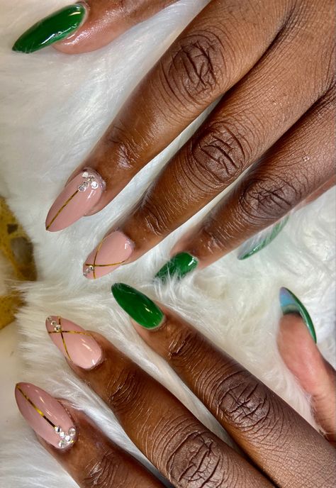 Almond shaped green and pink  acrylic nails. Middle and ring fingers have gold lines and rhinestones Green And Nude Nails, Nails With Gold Lines, Green And Pink Nails Designs, Pink And Green Nails Design, Green Nails With Gold, Green And Pink Nails, Blush Pink Nails, Money Nails, Nails With Gold