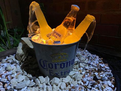 A BLOKE has revealed how to make an amazing beer water feature at home, and people absolutely love it. Danny Walters, from Wolverhampton, made the instructional video after being inundated with requests – from people impressed with his light-up Corona fountain. Posting on Facebook’s DIY On A Budget UK group, the beer drinker said: “A […] Danny Walters, Wine Bottle Outdoor, Wine Bottle Fountain, Yellowstone Party, Beer Garden Design, Barrel Fountain, Diy Waterfall, Diy Water Feature, Diy Water Fountain