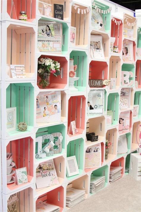 An all-over color change on a row of storage crates might be too much, but painting only the insides makes a lovely statement that doesn't feel childish. We love the pastel palette this blogger used in her trade show booth. See more at Chickaniddy »   - GoodHousekeeping.com Painted Crates, معرض فني, Dream Craft Room, Craft Fair Displays, Craft Show Displays, Craft Booth, Craft Room Storage, Crate Storage, Booth Display