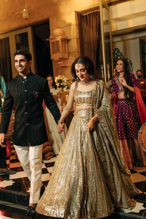 Presenting you latest Indian Sangeet Night Outfit ideas for Bride & Groom. From bridal gowns to bridal indo western outfits, we have got variety of sangeet outfits. #shaadisaga #indianwedding #sangeetoutfit #sangeetoutfitbridal #sangeetoutfitformen #sangeetoutfitbridalindowestern #sangeetoutfitbridalgown #sangeetoutfitforbride #sangeetoutfitideas #sangeetoutfitbridalunique #sangeetoutfitpunjabi #sangeetlehenga #sangeetlehengaforbride #sangeetlehengabridal #sangeetlehengadesigner #sangeetgown Indian Engagement Outfit, Reception Outfit For Bride, Indian Reception Outfit, Lehenga For Engagement, Engagement Dress For Groom, Wedding Matching Outfits, Udaipur Wedding, Engagement Dress For Bride, Engagement Lehenga