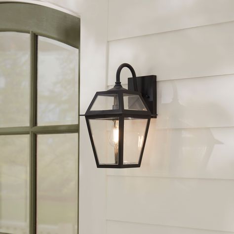 Transform your home's exterior with this stunning outdoor wall light that offers a stylish traditional design. Built to last with high-quality, non-corrosive, weather-resistant materials, this piece is perfect for illuminating any space. allen + roth Belasco 1-Light 15-in H Black Led, Outdoor Wall Light | WLM143BK Outside Farmhouse Lights, Exterior Home Lights, Outdoor Light Fixtures Garages, Exterior Cottage Lighting, Outdoor Sconces Garage, Porch Lights Ideas, Front Porch Hanging Decor, Covered Porch Lighting, Front Door Lighting Exterior