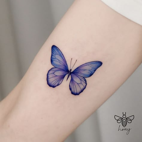 Tattoos For The Extroverted Soul: 5 Fun And Meaningful Tattoo Ideas – Self Tattoo Colored Butterfly Tattoo, Lotus Tat, Small Colorful Tattoos, Purple Butterfly Tattoo, Tattoo Wings, Colorful Butterfly Tattoo, Ring Tattoo Designs, Butterfly Tattoos On Arm, Blue Butterfly Tattoo