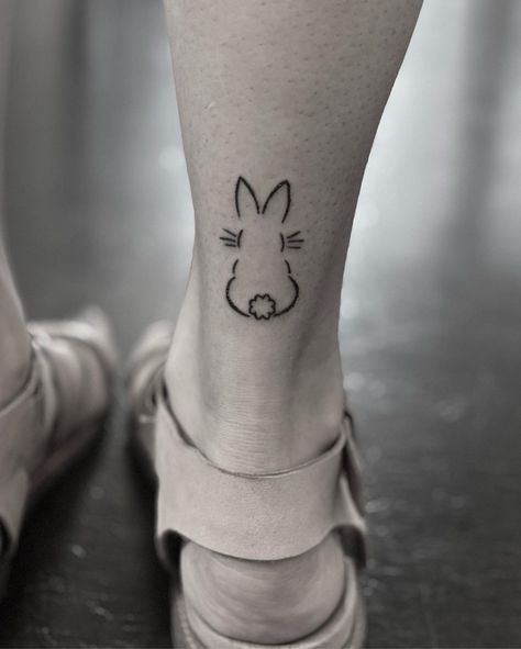 Back of a rabbit tattoo on back of leg Cute Bunny Tattoos For Women, Bunny Tiny Tattoo, Rabbit Tattoos For Women, Bunny Ear Outline Tattoo, Outline Bunny Tattoo, Bunny Paw Print Tattoo, Bunny Silhouette Tattoo, Small Rabbit Tattoo Simple, Pet Bunny Tattoo