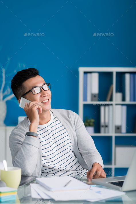 Young man calling on phone by DragonImages. Portrait of cheerful Vietnamese businessman calling on the phone #AD #calling, #phone, #Young, #man Man Calling On Phone, Calling Phone, Using Phone, Luxury Font, Dragon Images, Design Tshirt, On Phone, Asian Men, Business Man