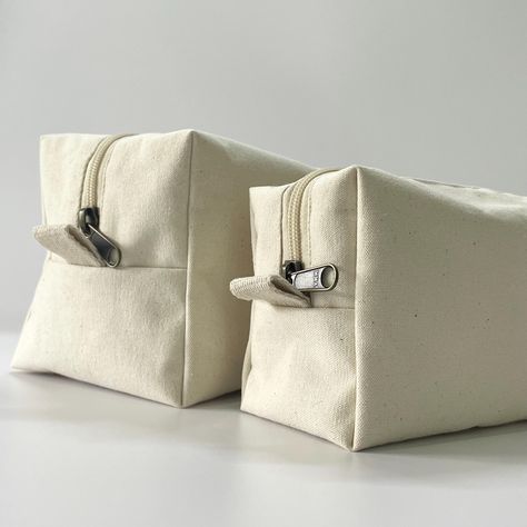 Elevate your travel essentials with our Natural Canvas Dopp Kit, crafted from eco-friendly, durable canvas and equipped with premium YKK zippers for added security and smooth operation. Perfect for organizing toiletries, skincare, shaving essentials, and more, this toiletry bag offers versatile storage options to suit all your travel needs. Each bag is designed with a minimalist aesthetic, making it a stylish choice for both men and women. Available in three sizes to suit different needs, you can purchase each one separately for a customized experience.  Product Features: ▸ Made from 100% natural, eco-friendly canvas fabric ▸ High-quality YKK zippers for durability and easy use ▸ Unisex design suitable for all ages and styles ▸ Perfect for various uses: toiletry bag, makeup organizer, or s Shaving Essentials, Organizing Toiletries, Organized Packing, Travel Cases, Toiletry Kit, Dopp Kit, Bag Makeup, Travel Needs, Toiletry Storage