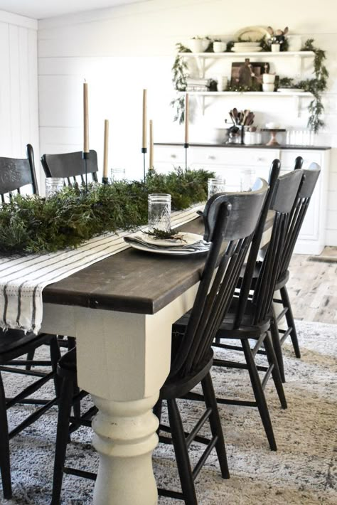 Simple natural Christmas table setting in a rustic farmhouse style. Use real and faux greenery combined to create a Christmas centerpiece garland on top of a table runner with black candleholders. #rockyhedgefarm #simplechristmas #farmhousechristmas #rusticchristmas Havalance Dining Table, Dining Table With Accent End Chairs, Centerpiece Garland, Furniture Refurbishing, Table Runner Farmhouse, Rustic Kitchen Tables, Dining Table Makeover, Kitchen Table Makeover, Christmas Table Setting